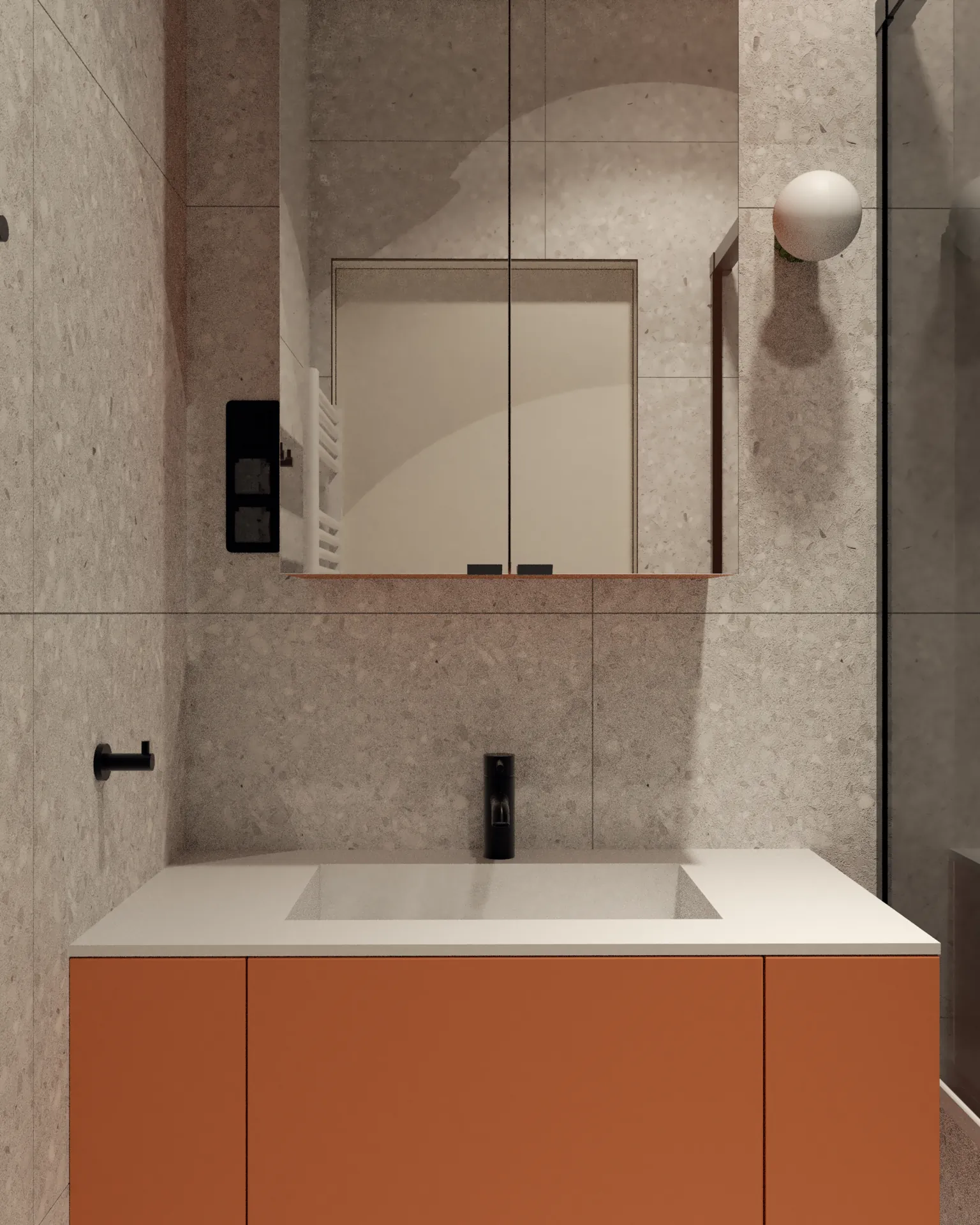 Nowoczesna łazienka z pomarańczową szafką pod umywalkę, dużym lustrem i minimalistyczną armaturą.