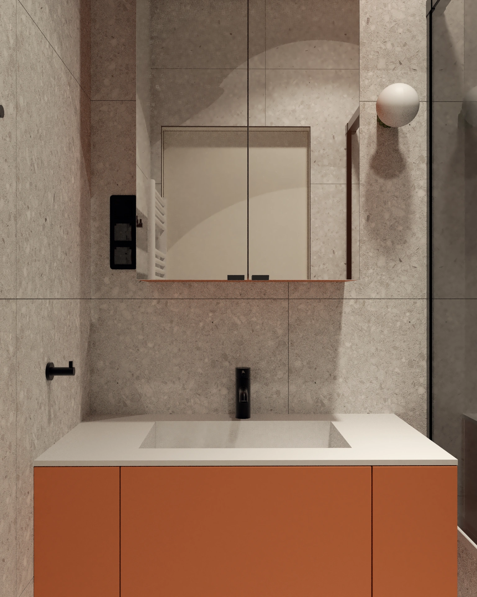 Nowoczesna łazienka z pomarańczową szafką pod umywalkę, dużym lustrem i minimalistyczną armaturą.