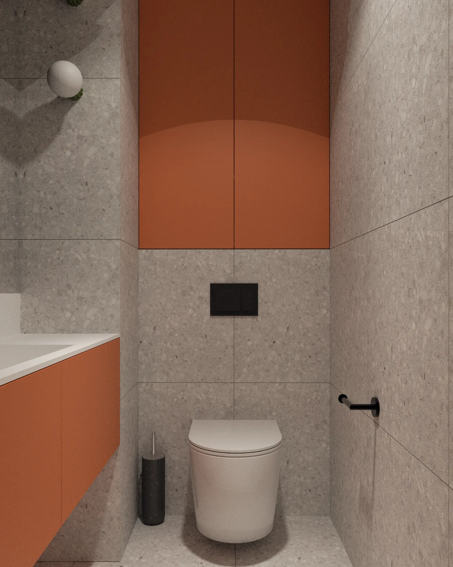 Toaleta w nowoczesnej łazience z pomarańczową zabudową meblową, ukrytym miejscem do przechowywania i płytkami w odcieniach szarości.