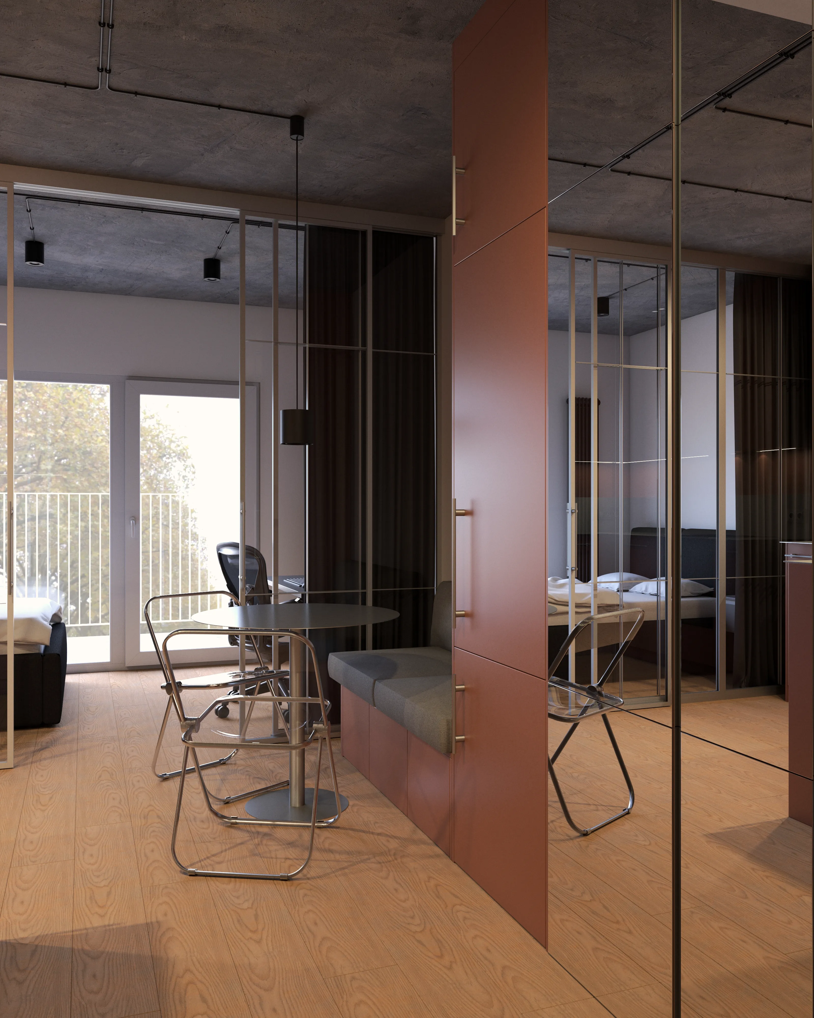 Jadalnia w małej kawalerce z okrągłym stołem i metalowymi składanymi krzesłami – strefa jedzenia przy zabudowie kuchennej, projekt Nalalab.