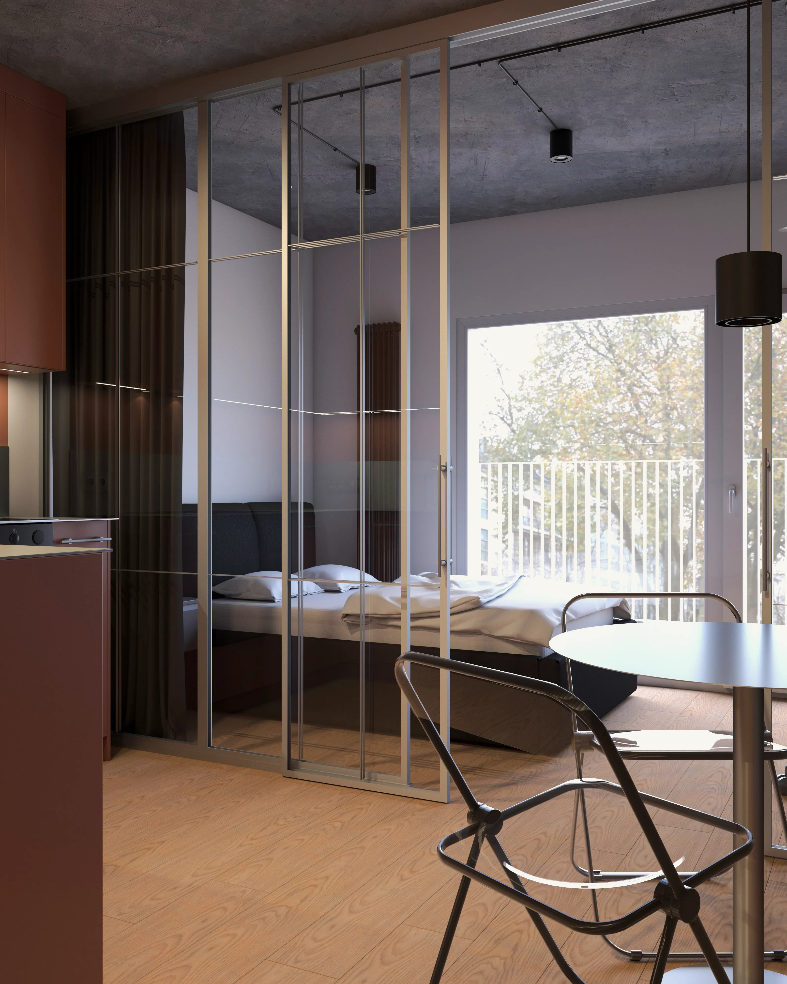 Widok z kuchni przez szklaną ściankę w stalowej ramie na sypialnię i jadalnię – naturalne światło, okno z balkonem, aranżacja małego mieszkania w Warszawie.