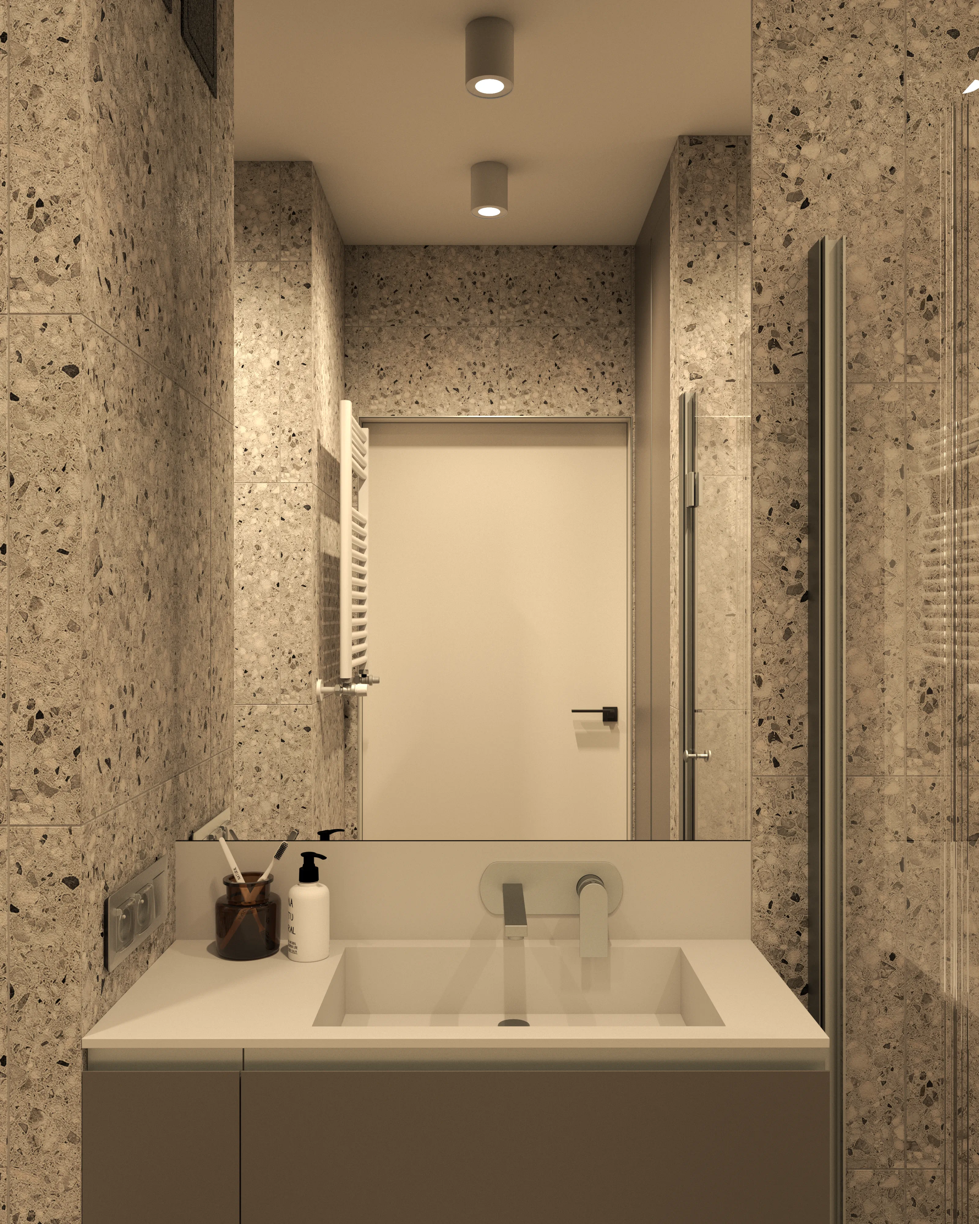 Strefa umywalki: umywalka wpuszczana w blat, lustro bez ramy, ściany w płytkach terrazzo, punktowe oświetlenie – projekt łazienki Nalalab.